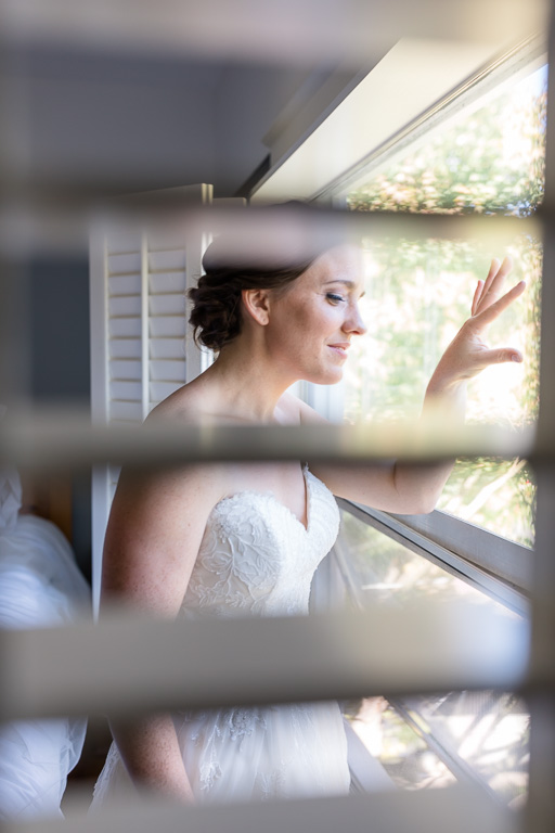 cute moment when bride peeks out of the window