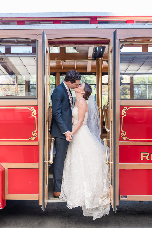 bride and groom wedding portrait on Rosie the trolley