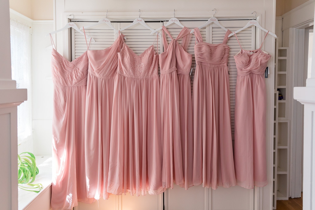 blush long bridesmaid dresses in a row