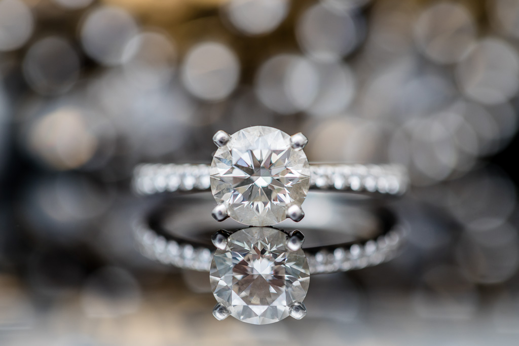 stunning diamond wedding ring shot with reflections