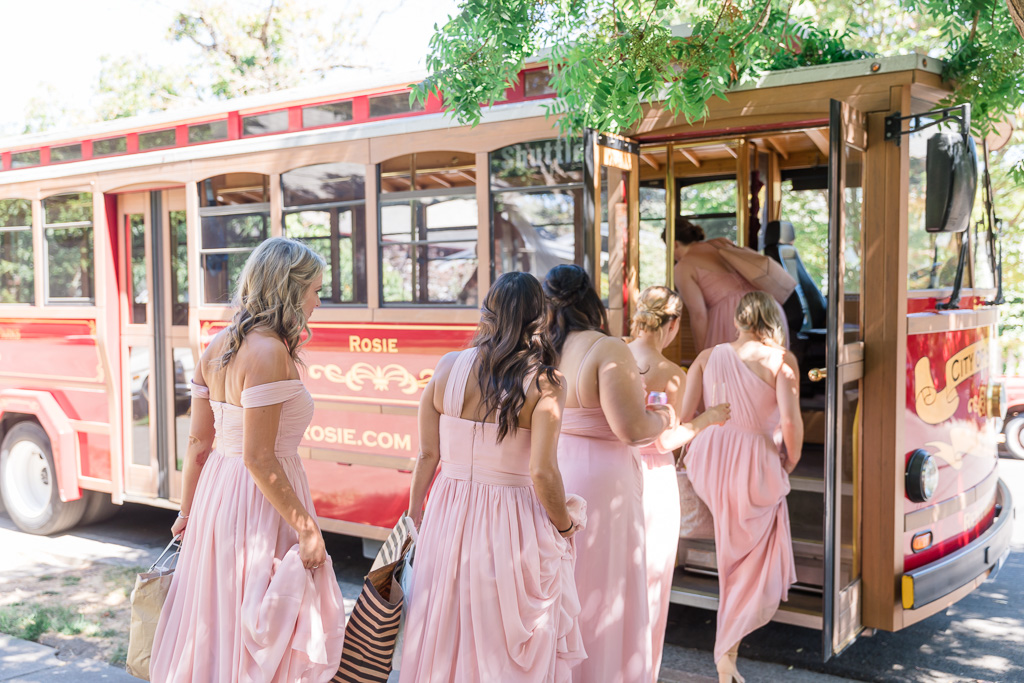 wedding party getting on the trolley