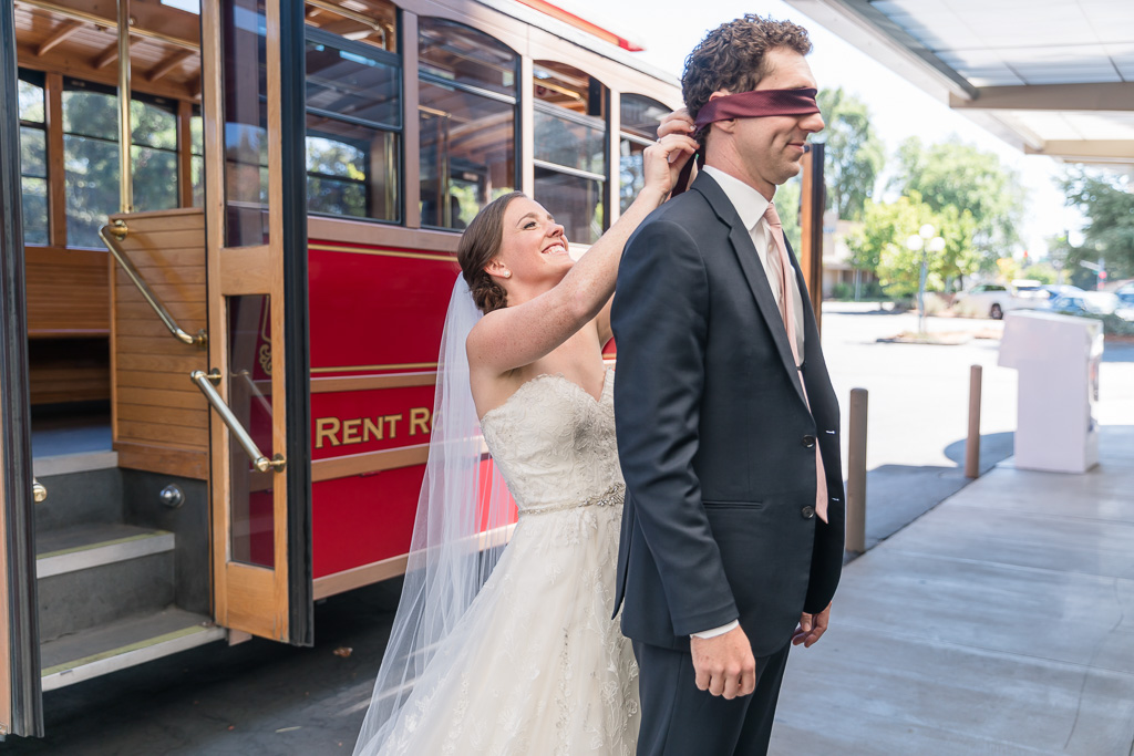 wedding first look in front of Rosie the Santa Rosa trolley