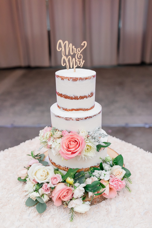 San Francisco gorgeous naked wedding cake with pastel color flowers