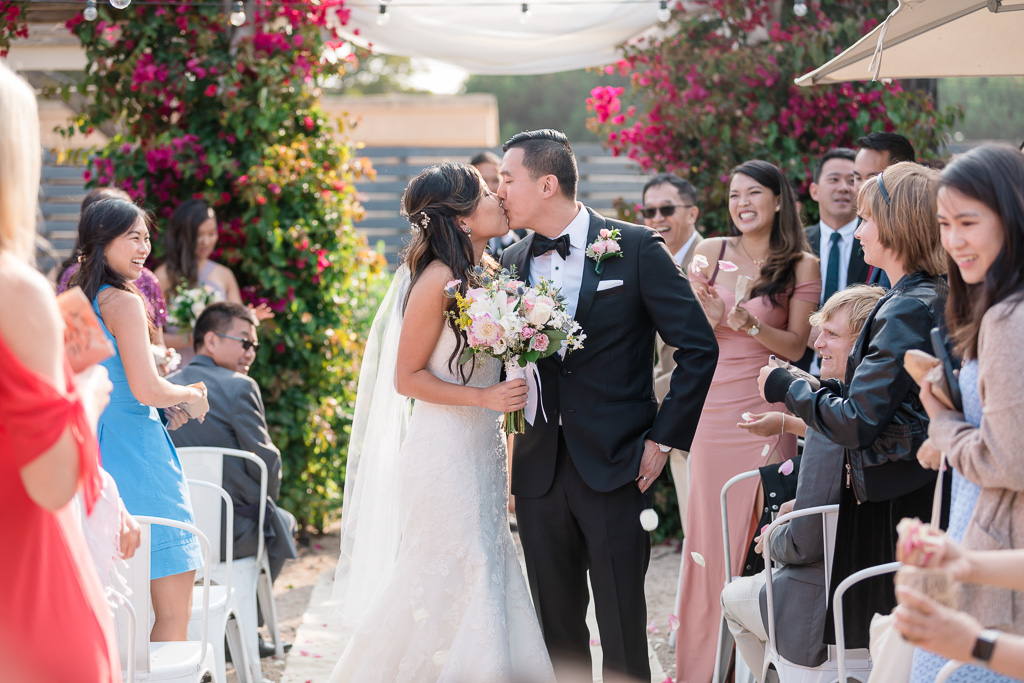 bride and groom's recessional kiss