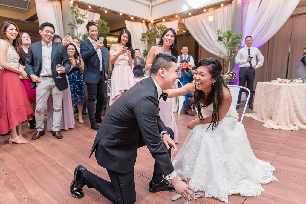 bride successfully iced her groom during the garter toss
