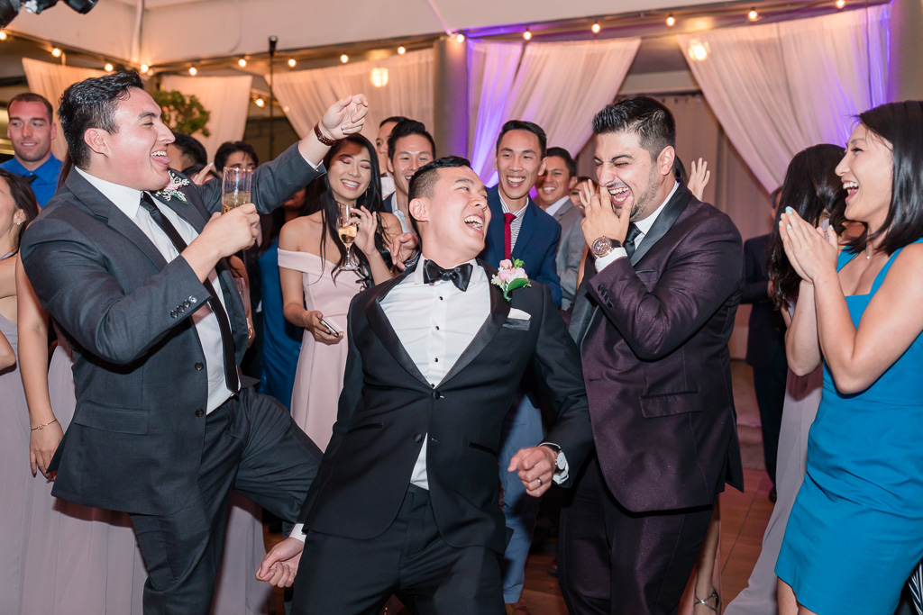 groom dancing with his crew