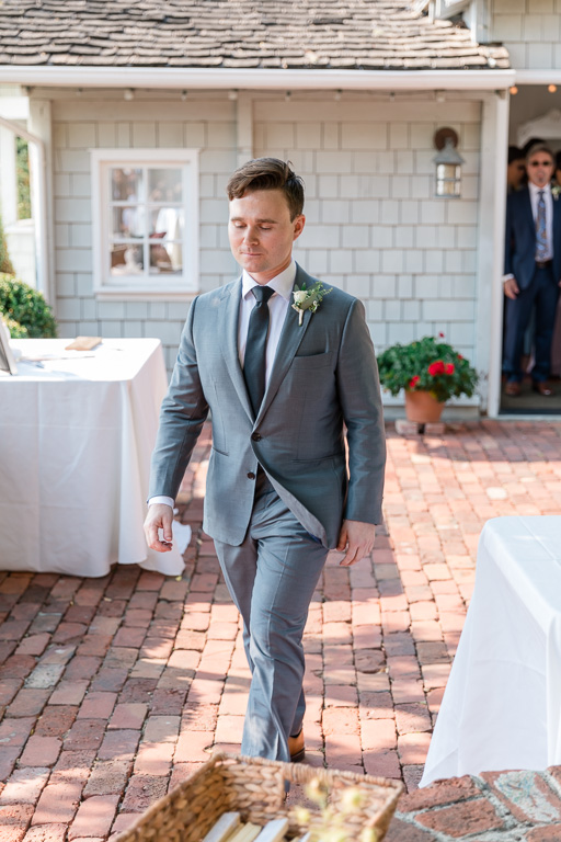 groom walking to the ceremony