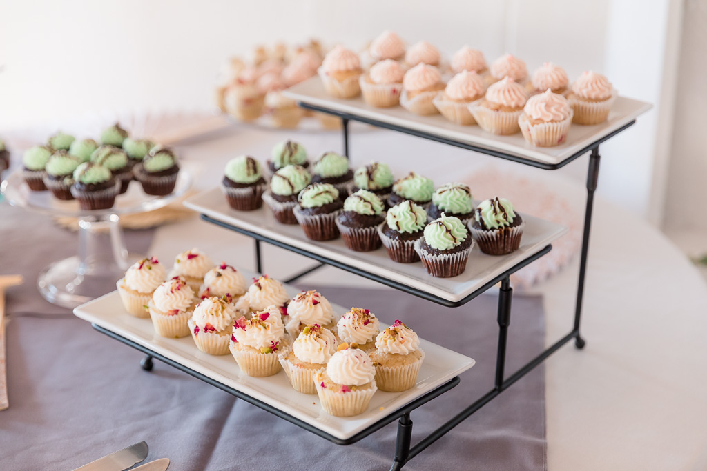 wedding cupcakes displayed on a cute stand