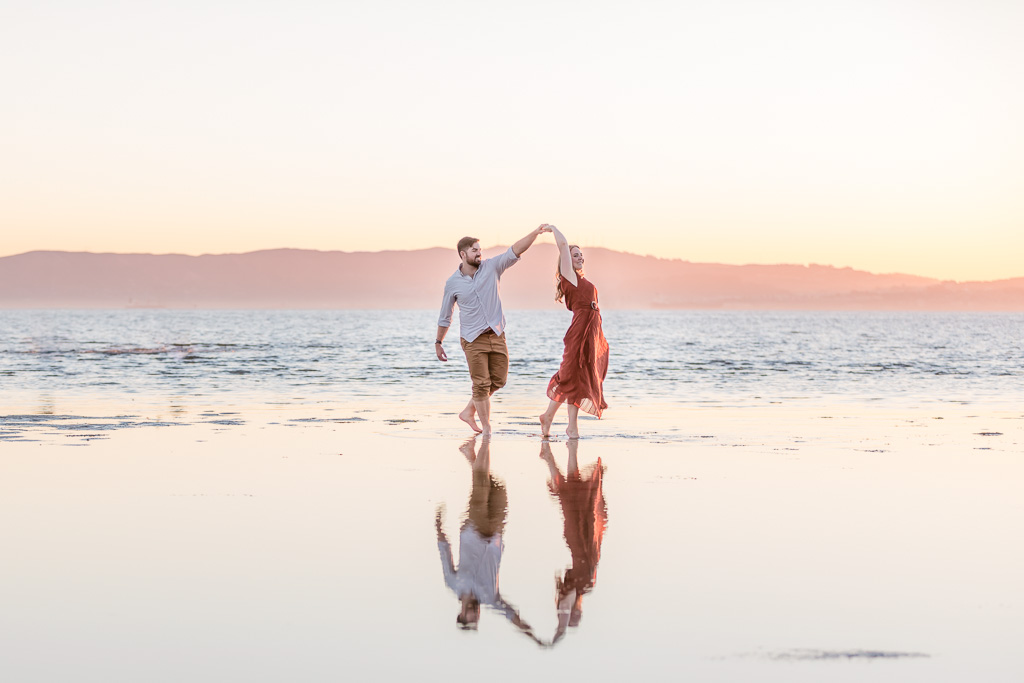 fun and candid beach engagement photo in Alameda