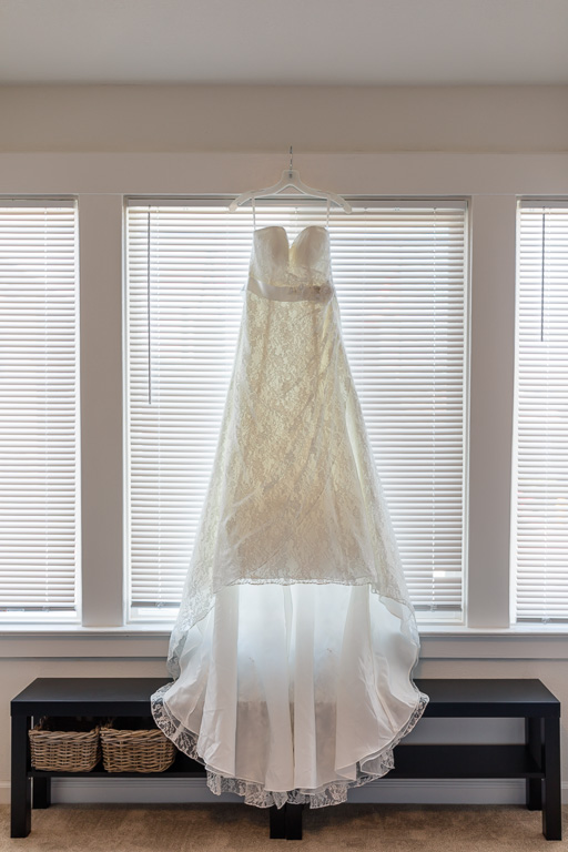 white dress hanging on window