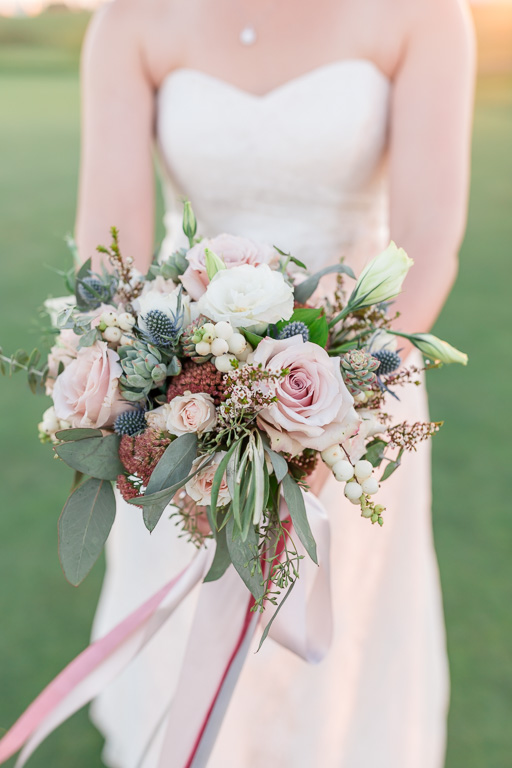 bride holding wedding floral bouquet