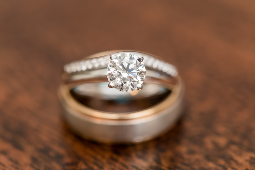 close-up of wedding and engagement rings