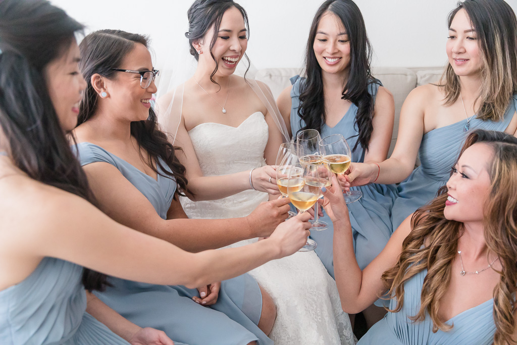 bride celebrating with bridesmaids