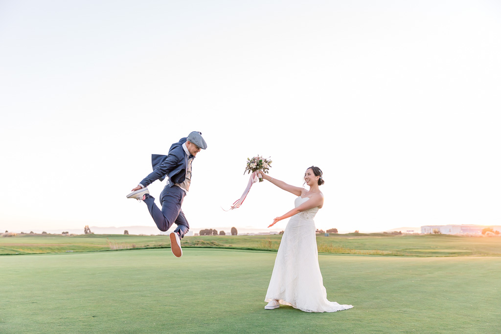 Fairview Metropolitan wedding bride groom jumping in the air portrait at sunset