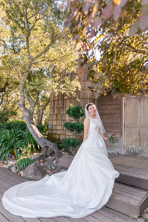 Thomas Fogarty Winery bride solo portrait with her dramatic wedding gown