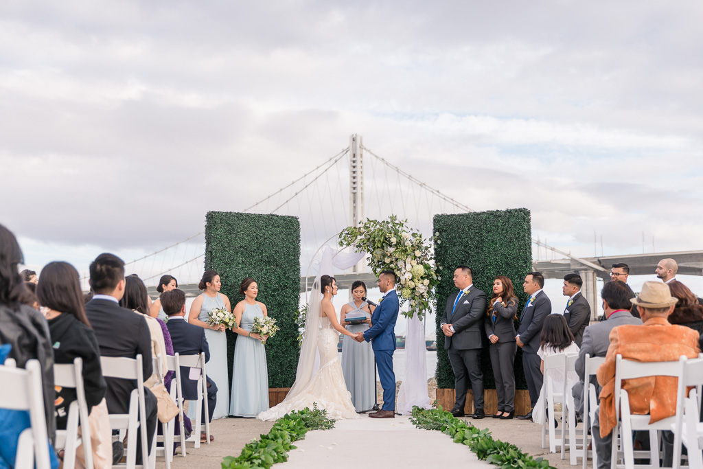 The Winery SF wedding ceremony with Bay Bridge in background