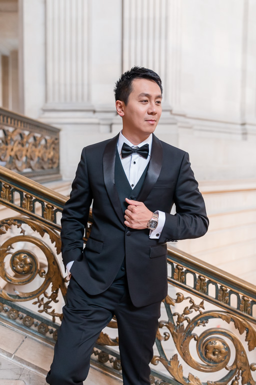 groom portrait by City Hall staircase