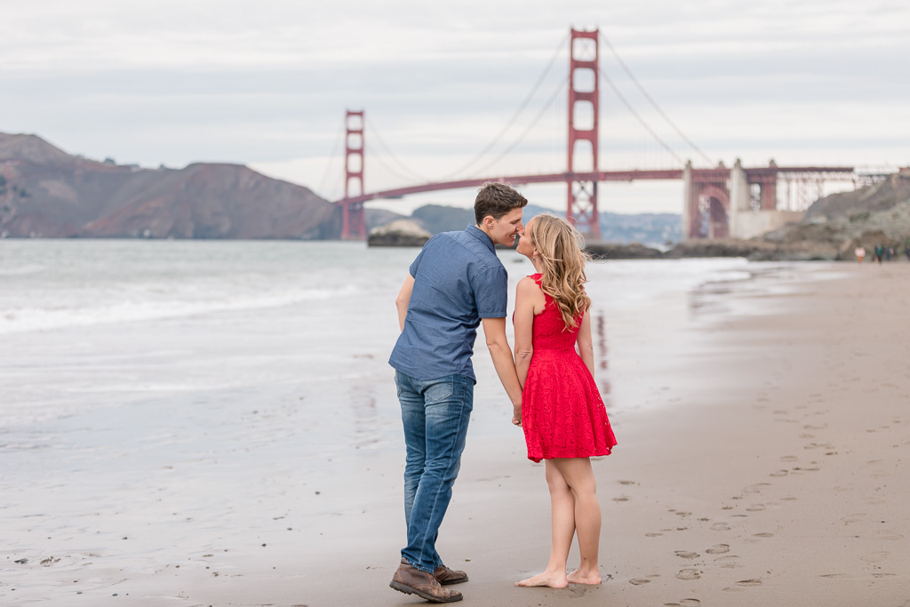 baker beach engagement photo with beautiful sunset colors