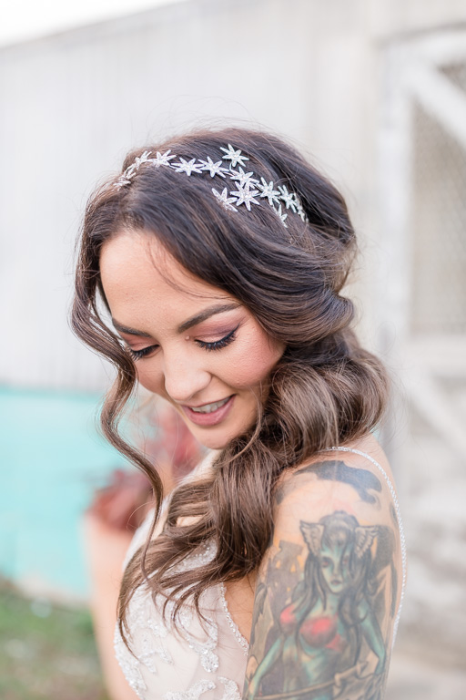 close-up of bride with tattooed shoulder and hairpiece