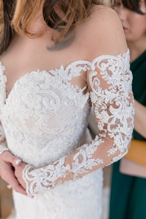 lace details of the illusion neckline of the martina liana wedding gown