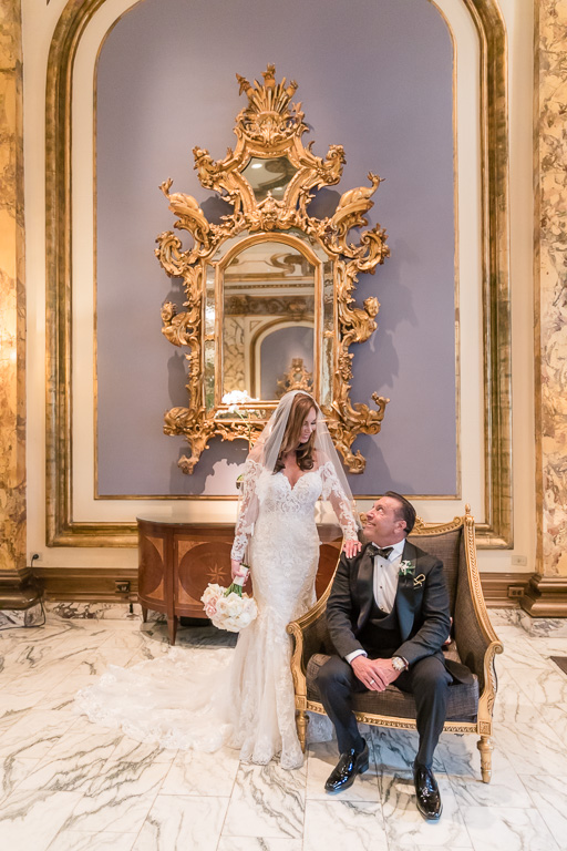 bride and groom portrait at the San Francisco Fairmont hotel lobby