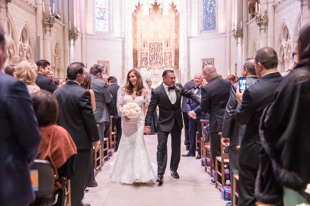 walking down the aisle and high-five with their guests