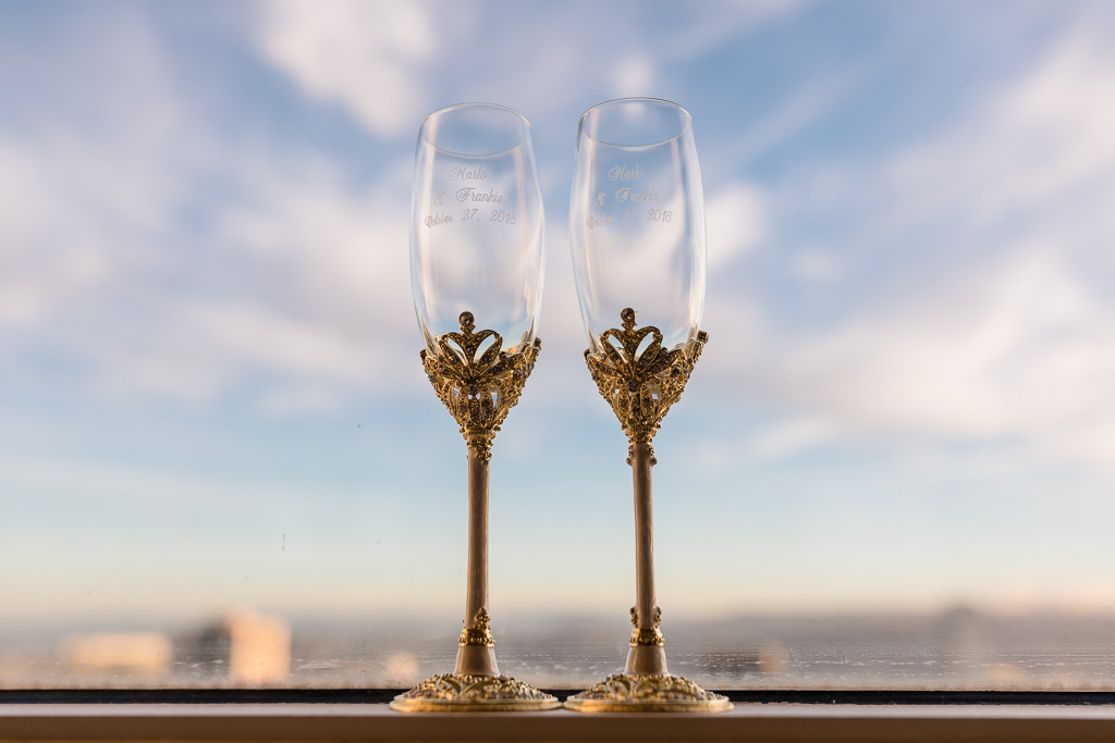 fancy wedding champagne flutes in front of San Francisco city skyline