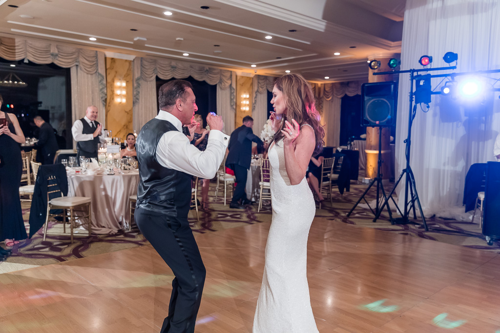 bride and groom dancing with each other