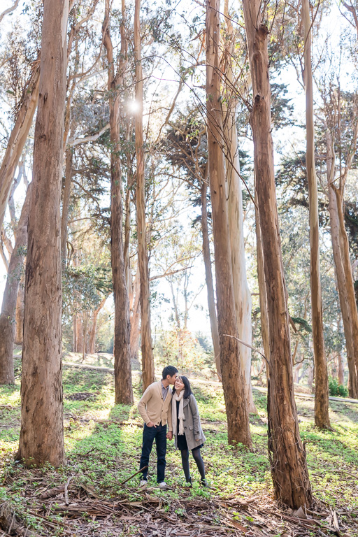 sunny lovers lane engagement photo in the woods