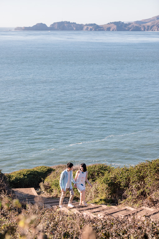 engagement photo on hiking trail by the sea