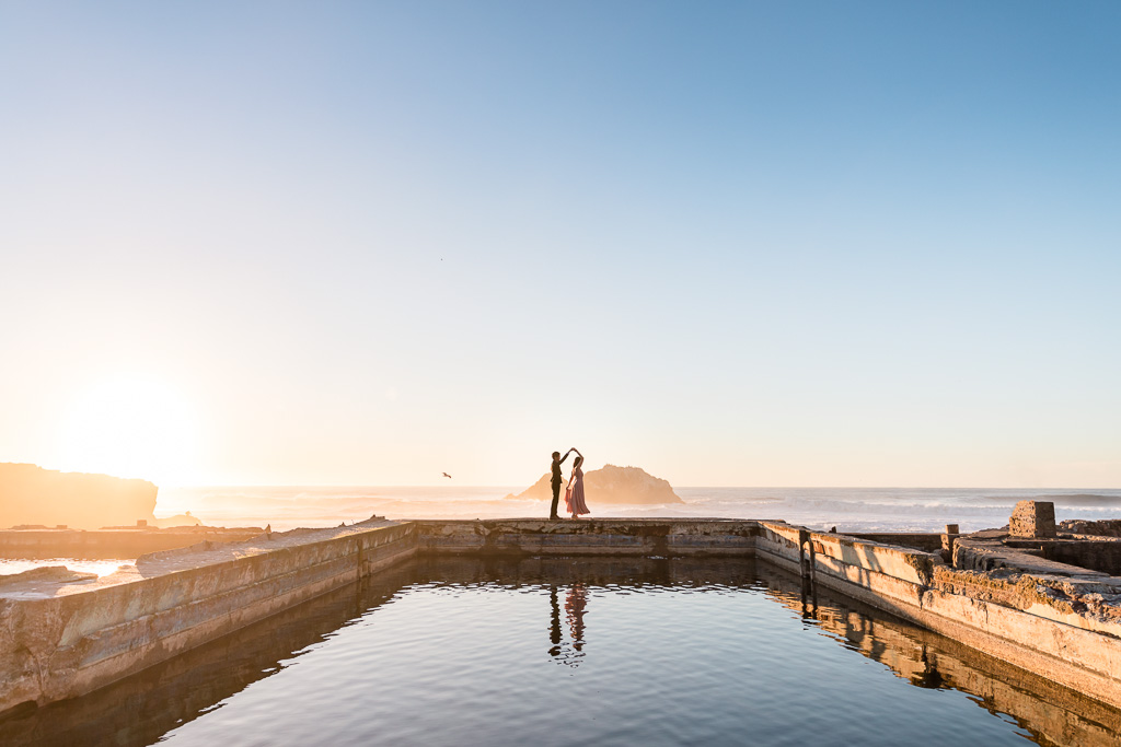 Photo of couple twirling on the Sutro Baths ruins