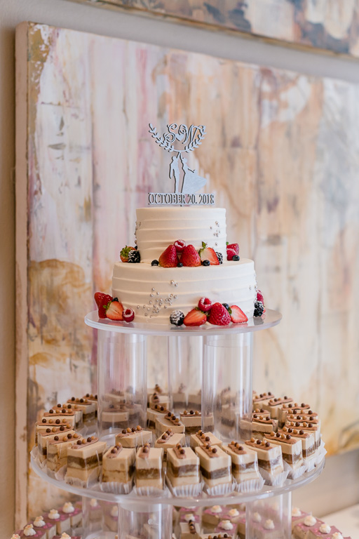 wedding dessert display with a cake at the top