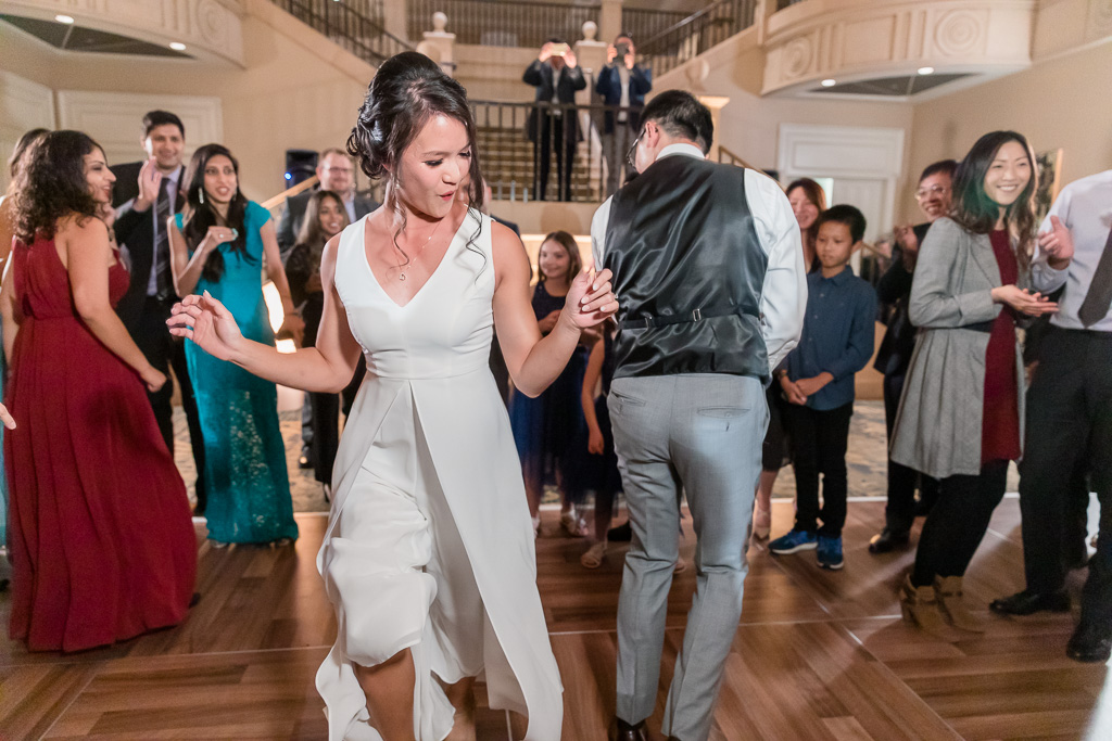 bride and groom being funky during their dance party