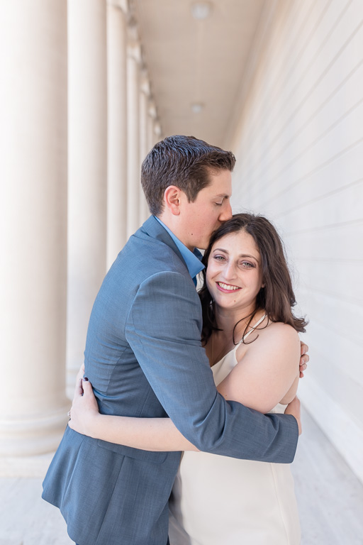 couple cuddling for their engagement session