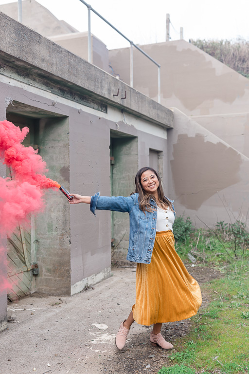 girl dancing with a pink smoke grenade