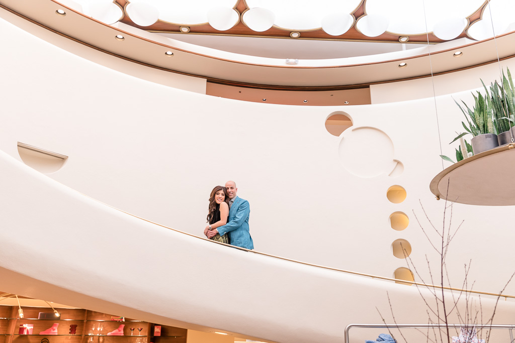 white spiral staircase posed engagement shoot