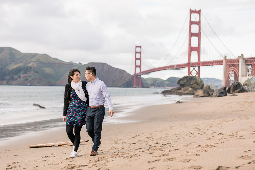 couple walking on the in San Francisco soft sand beach
