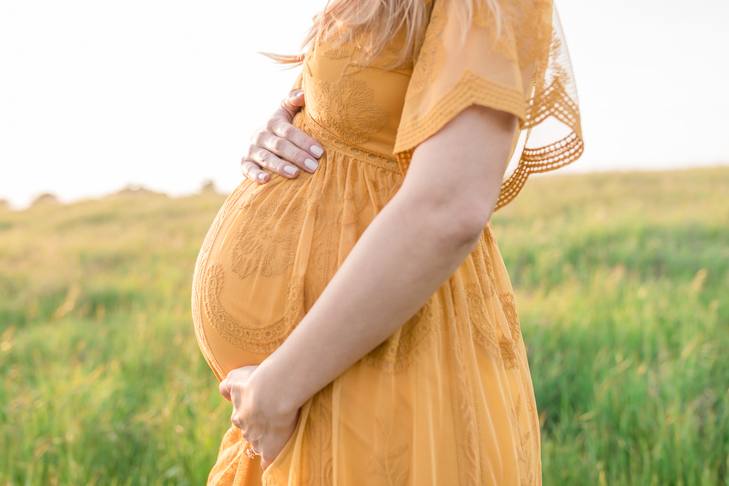 baby bump photo in yellow dress