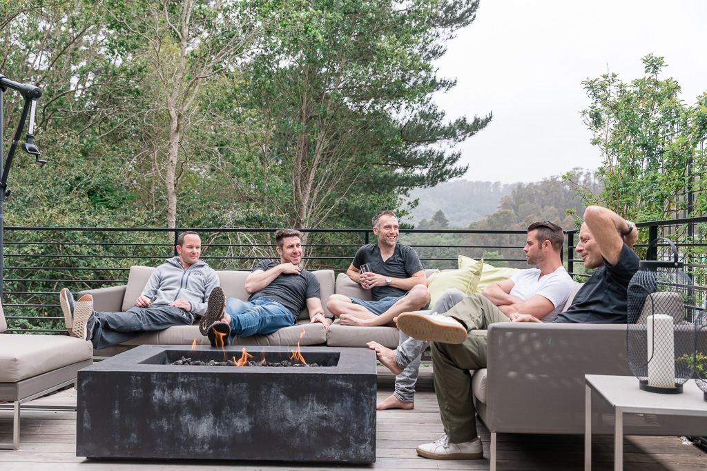 guys chilling by the patio fireplace