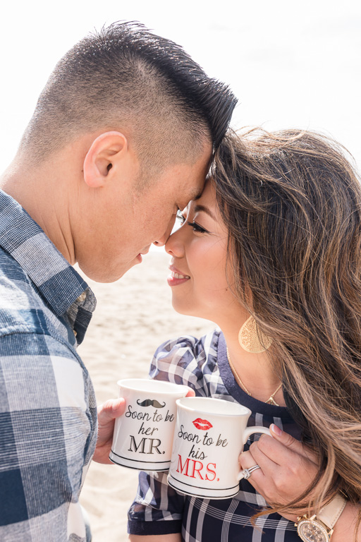 cute portrait of San Francisco couple holding their engagement mug