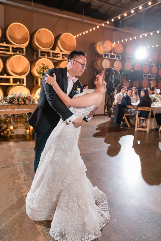 a romantic dip during the first dance at Domenico Winery