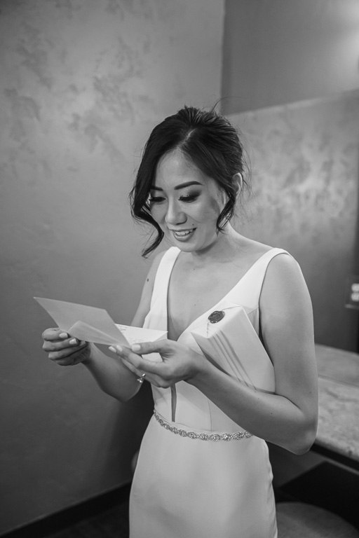 bride reading groom's sweet note to her