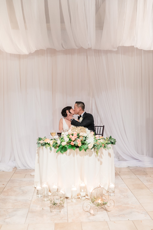 newlywed kissing at Casa Real reception hall
