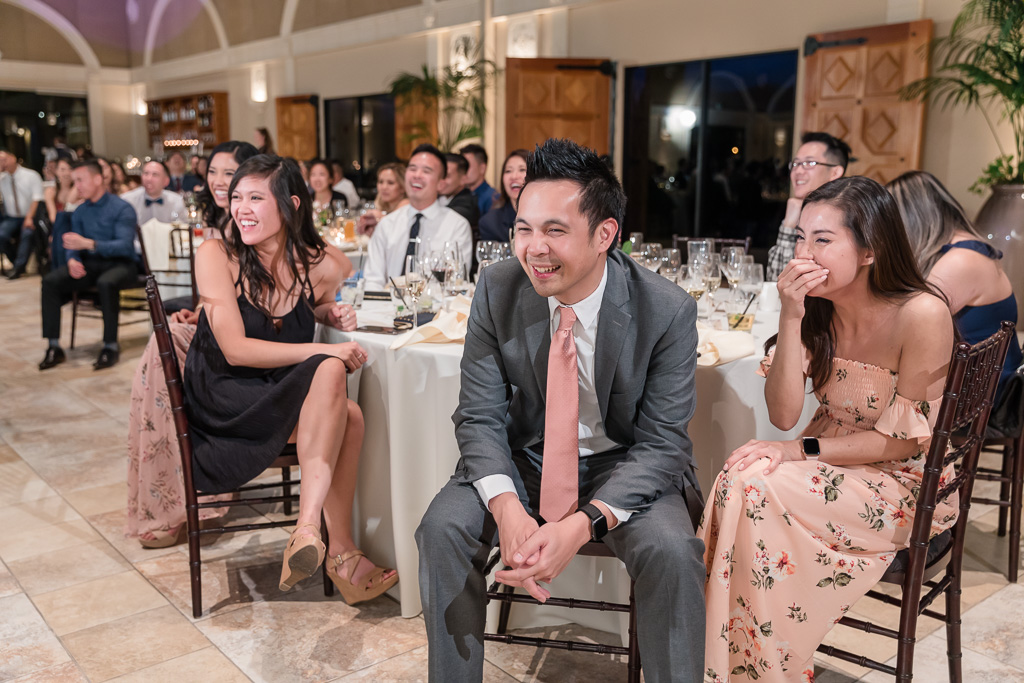wedding guests laughing at the toast