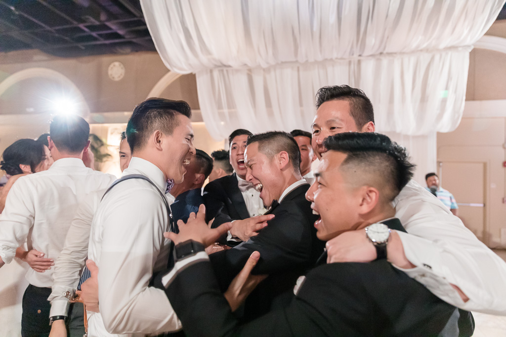groom dancing with his groomsmen