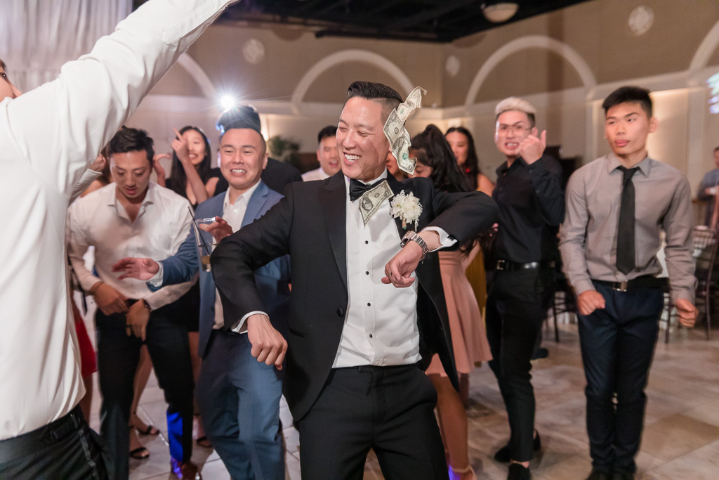 groom dancing at the reception