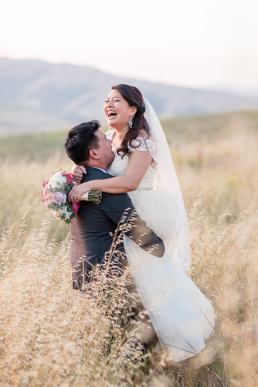 candid laughing photo of the bride and groom - Sunol wedding photographer