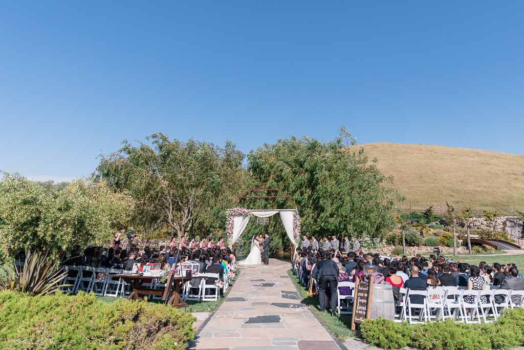 Sunol wedding ceremony surrounded by trees and mountains