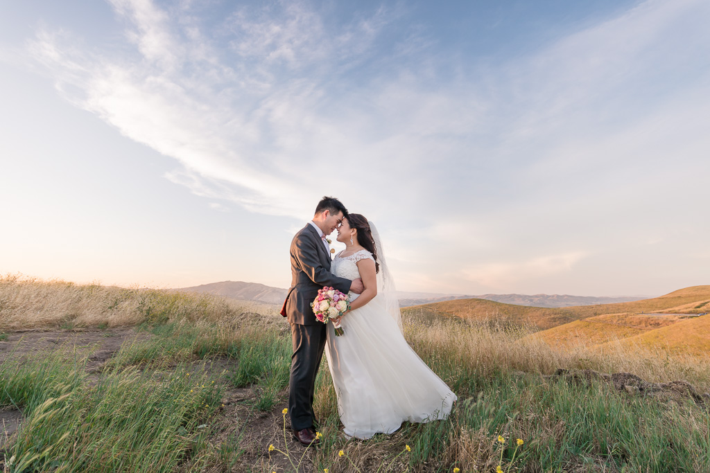 bride and groom in the open field in Sunol