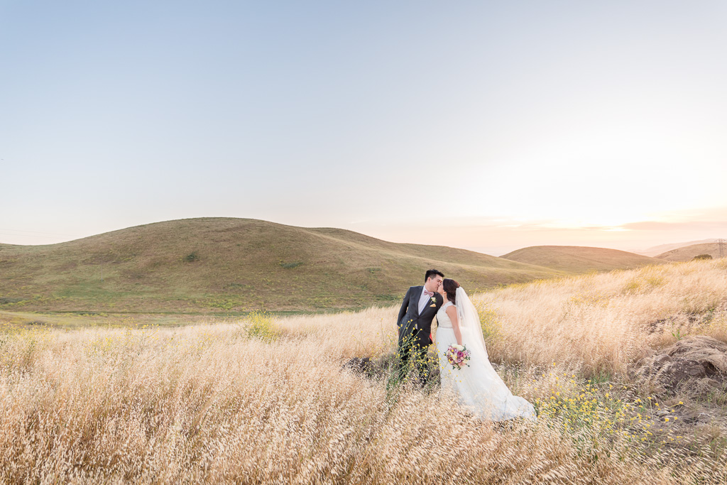 breathtaking Nella Terra Cellars wedding sunset portrait in the grassy hills